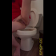 Emi sits on the toilet in a red top and spreads her legs as she shits lava diarrhea into the bowl. Vertical format video. Over 5.5 minutes.